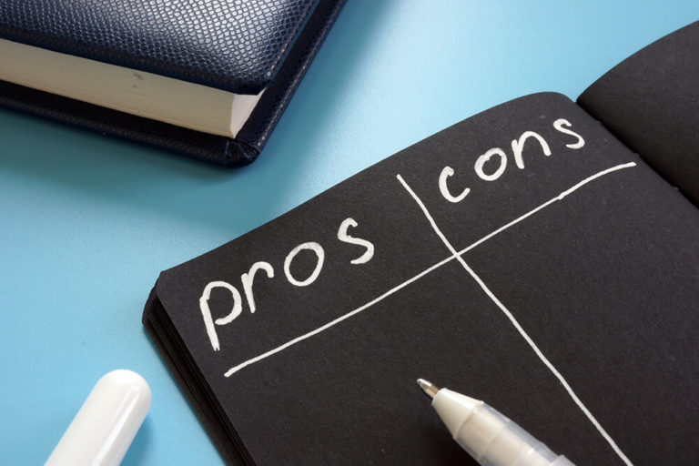 illustration of a pros and cons list on a black sheet of paper